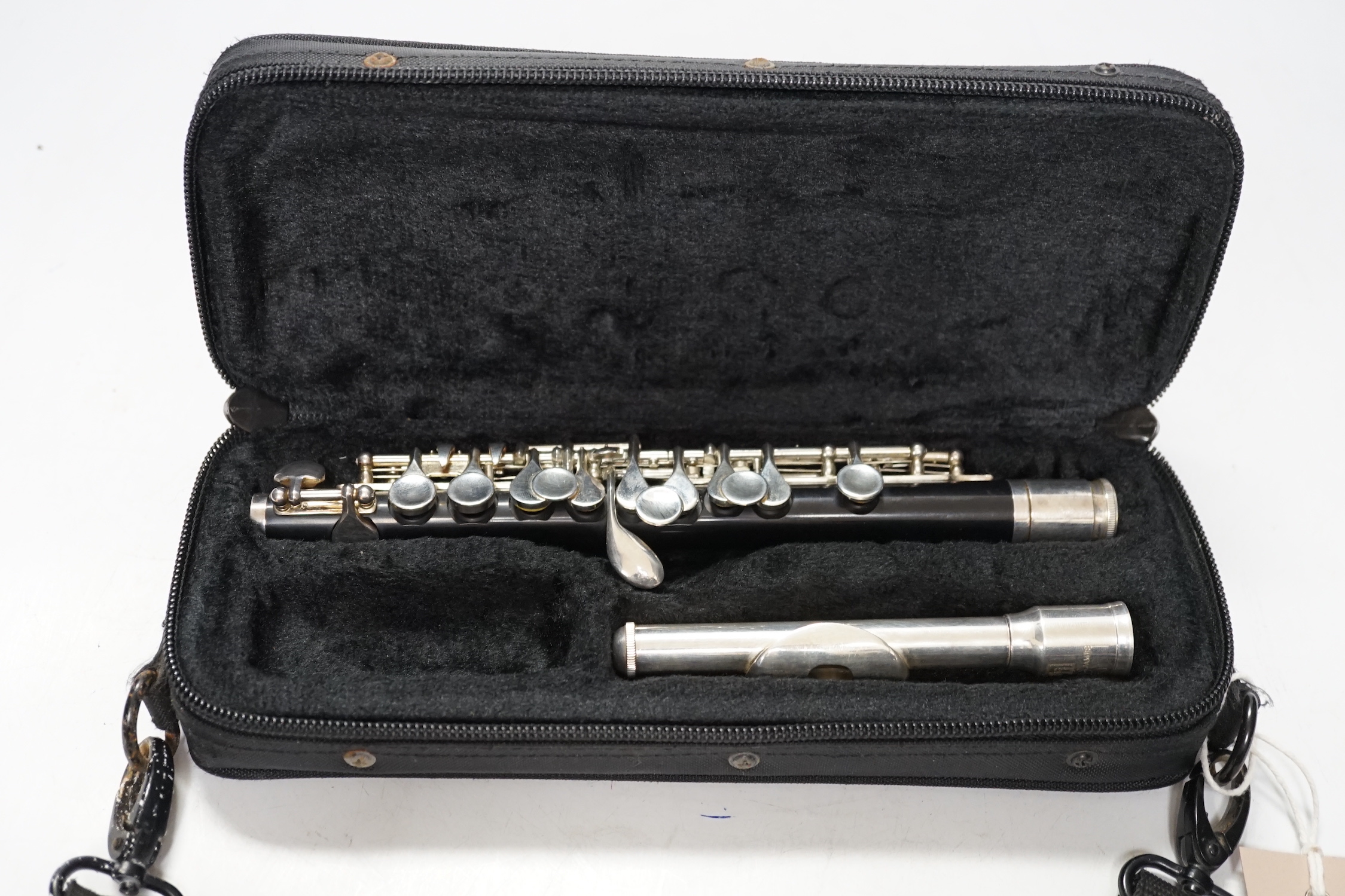 A cased Trevor James student’s piccolo, P1